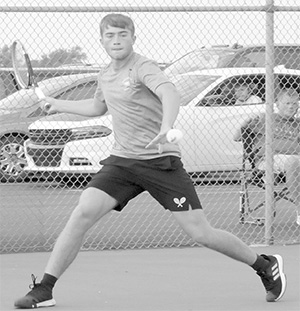 Clayton Hull hitting a tennis ball